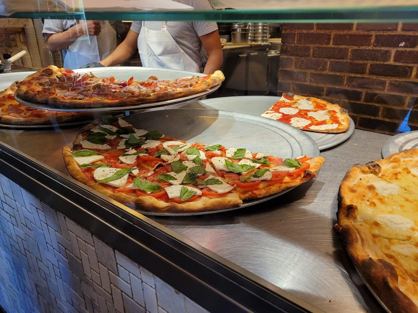 Fresh pizza being prepared
